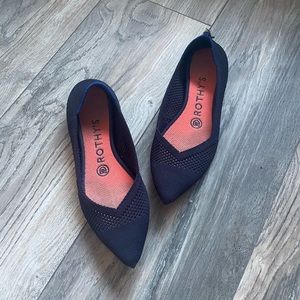 Navy Rothy’s pointy toe flats